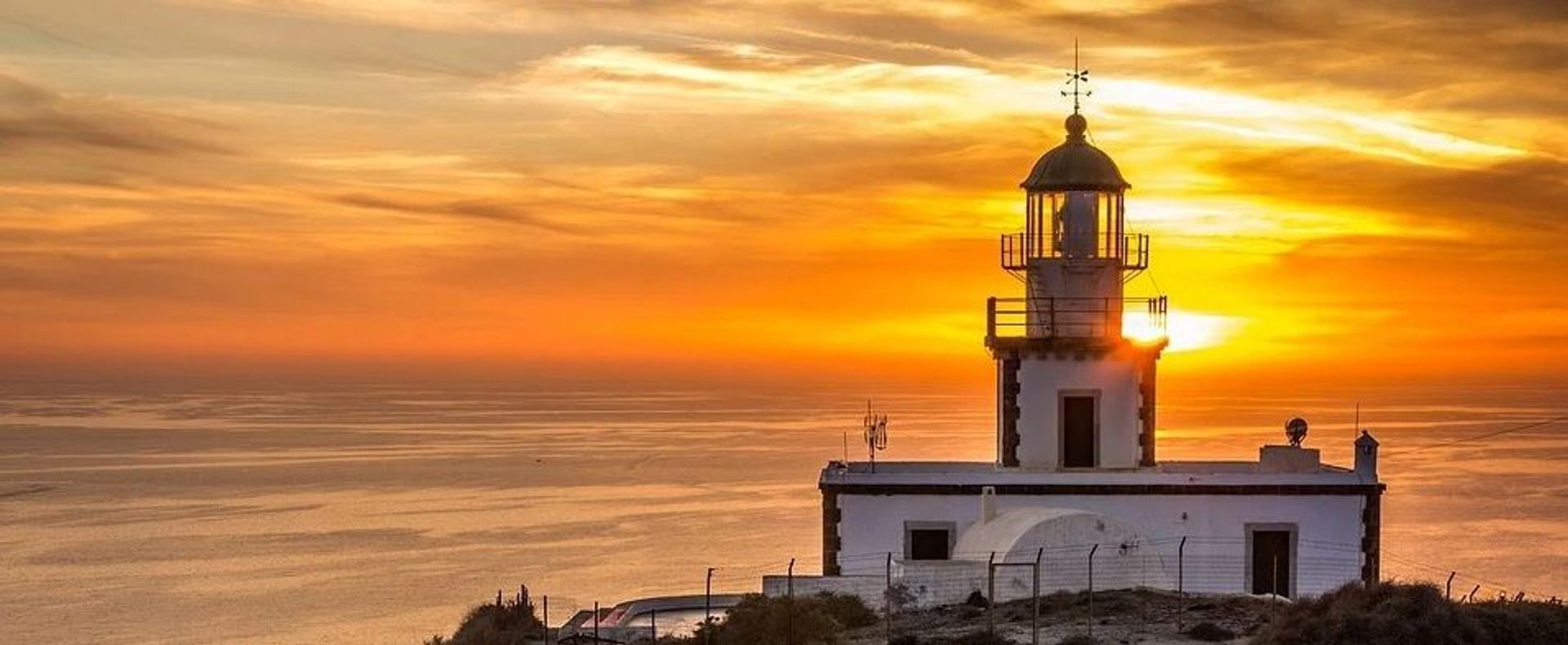 Santorini lighthouse sunset
