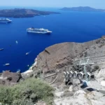 Top of the Cable Cars in Fira ,Santorini with view of two cruise ships and Volcano visible with Therasia