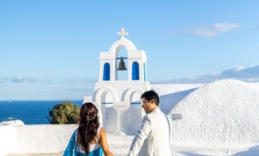 Oia photo with a couple in front of a church