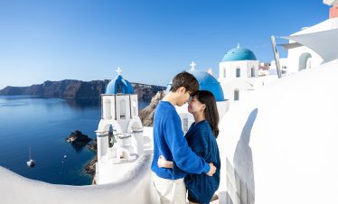 santorini blue domes photo with a couple