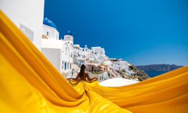 gold flying dress santorini at caldera