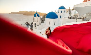 red flying dress Santorini