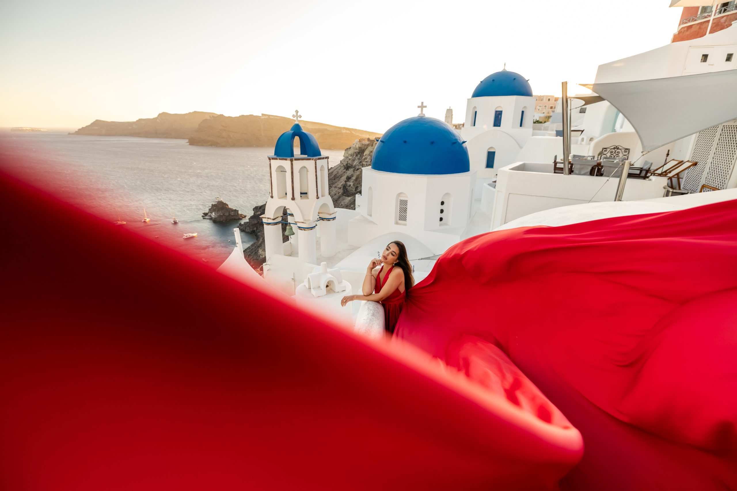 red flying dress Santorini