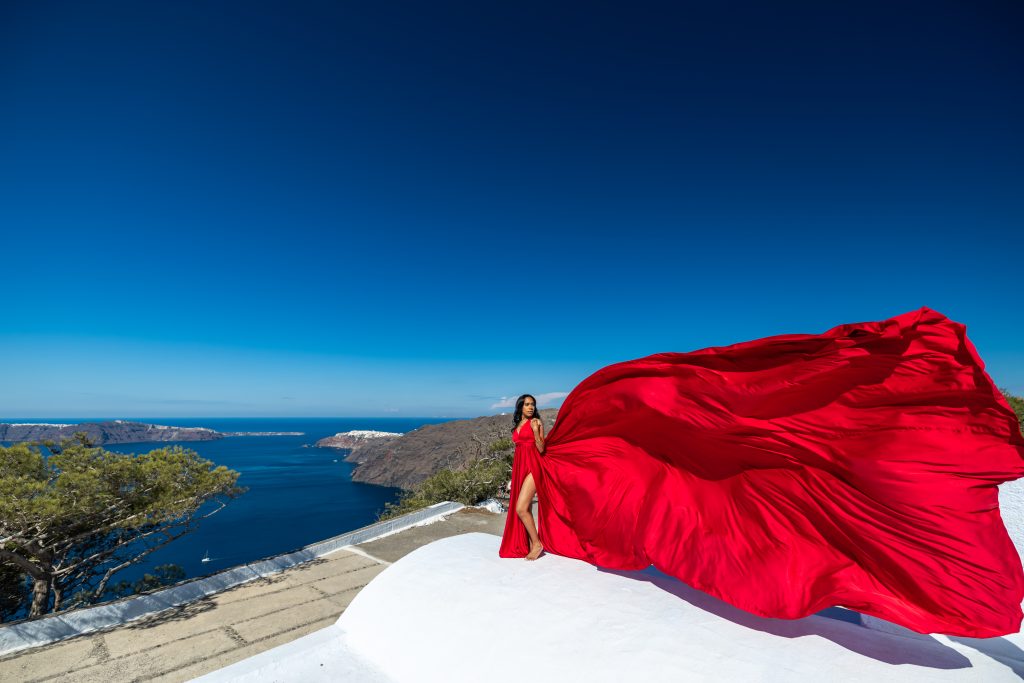 red flying dress photography Santorini