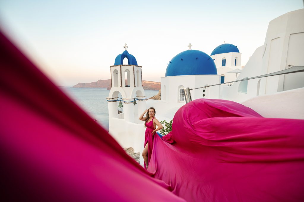 hot pink flying dress photography Santorini