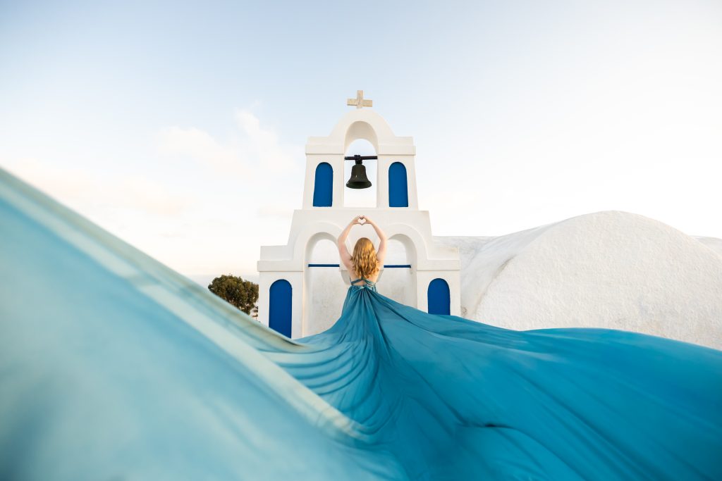 dusty blue flying dress photography Santorini