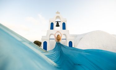 dusty blue flying dress photography Santorini