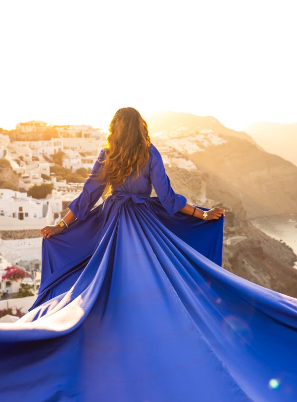 Blue long sleeve flying dress photography Santorini