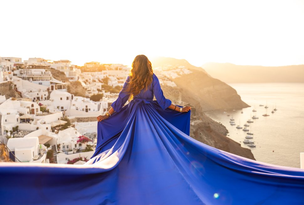 Blue long sleeve flying dress photography Santorini
