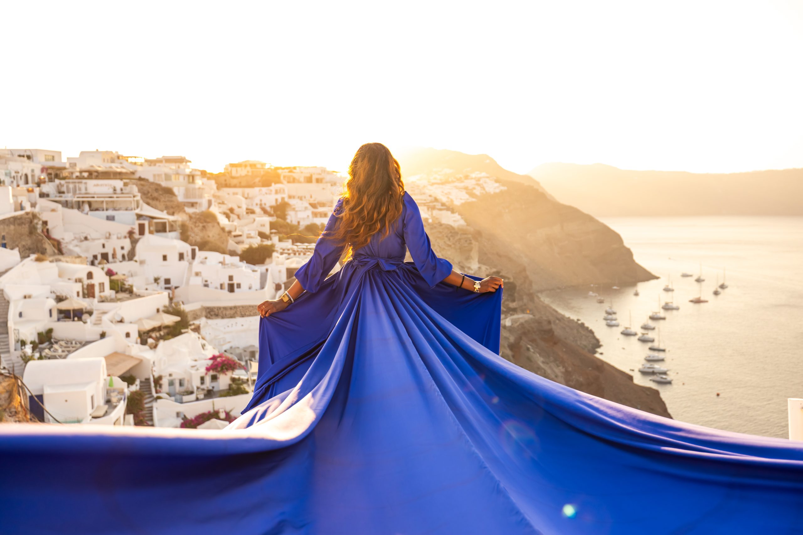 Blue long sleeve flying dress photography Santorini