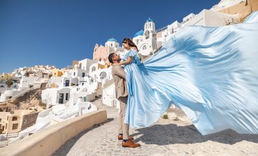 couple flying dress photoshoot in Santorini