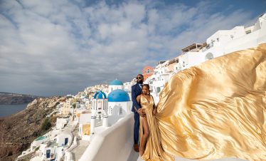 golden flying dress in Santorini
